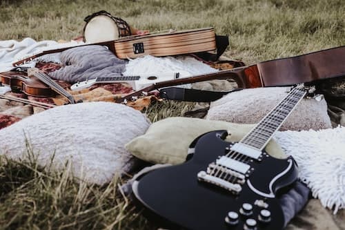 Guitars laid down in a field